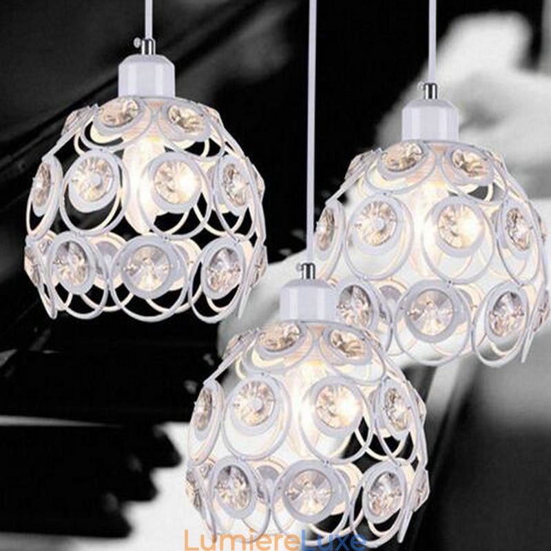 Idées de lampes suspendues en fer et cristal creux pour îlot