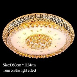 Plafonnier rond en cristal absorbant, diamètre 80 cm, contient 15 ampoules.